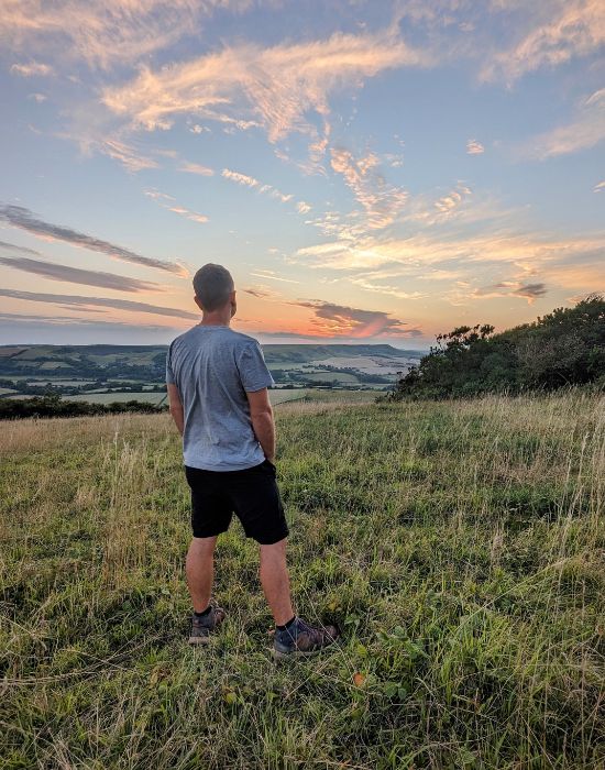 Steve looking out at the setting sun over the South Downs